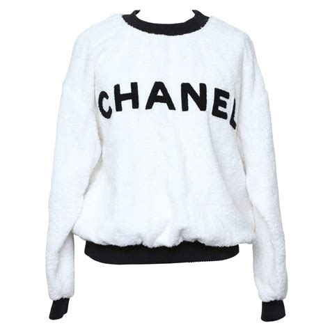 chanel jumper gold logo|chanel sweater black and white.